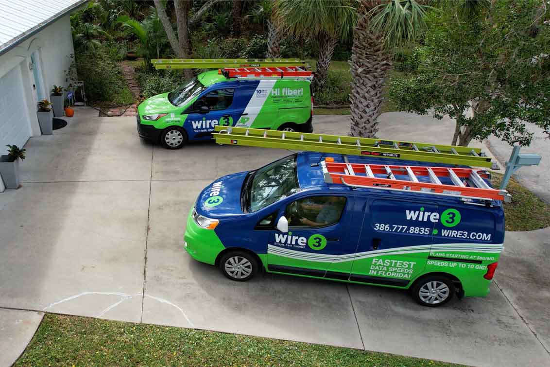 Photo fo Wire 3 vans in customer driveway