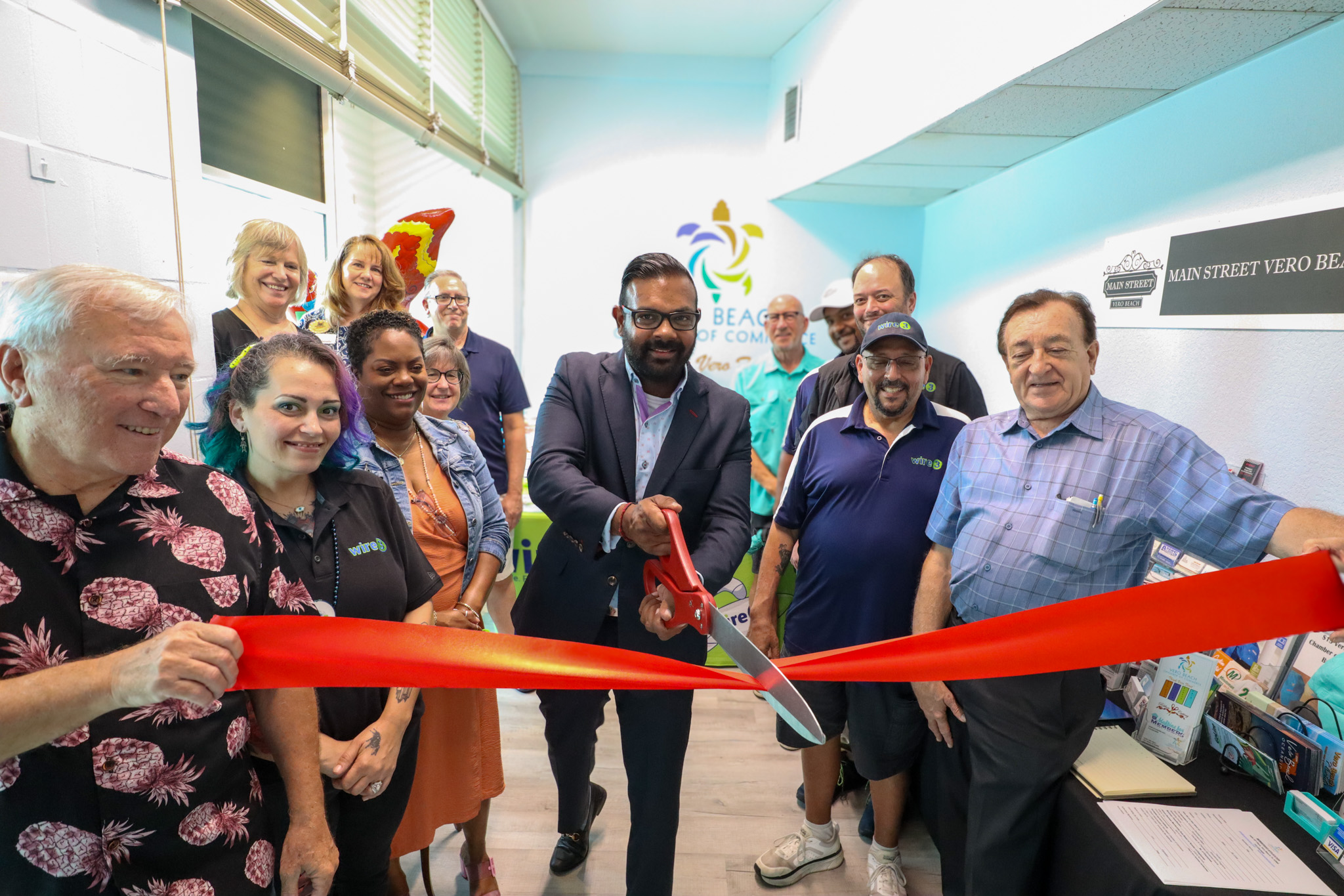 Wire 3 CEO Jai Ramachandran Celebrates a Local Business Opening in Florida Wire 3 CEO Jai Ramachandran cuts the ribbon at the opening of a local business in Florida